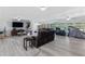 Bonus room with a TV, furniture, and view of the backyard at 622 Avenue D Se, Winter Haven, FL 33880