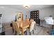Formal dining room features a wooden table, seating for six, and ample natural light at 622 Avenue D Se, Winter Haven, FL 33880