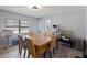 Dining room with a large table, seating, and view of other room in the house through a partial wall at 622 Avenue D Se, Winter Haven, FL 33880