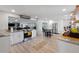 Bright kitchen featuring white cabinetry, granite countertops, a breakfast bar, and stainless steel appliances at 622 Avenue D Se, Winter Haven, FL 33880