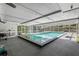 In-ground pool inside large screened lanai with adjacent bar and barbecue at 622 Avenue D Se, Winter Haven, FL 33880