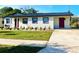 Charming home featuring a well-manicured lawn and fresh landscaping at 6366 Forecastle Ct, Orlando, FL 32807
