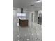 Open kitchen with stainless appliances, contrasting backsplash, and large island at 6366 Forecastle Ct, Orlando, FL 32807