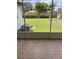 Screened patio featuring neutral tile flooring, views of the backyard, and space for outdoor seating at 6366 Forecastle Ct, Orlando, FL 32807
