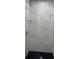 A sleek walk-in shower features marble tile and modern fixtures at 6366 Forecastle Ct, Orlando, FL 32807