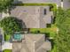 Aerial view showcases the roof, landscaping, and neighborhood layout at 6971 Tettenhall Ln, Windermere, FL 34786