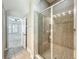 Spacious bathroom showcasing a tiled shower with glass door at 6971 Tettenhall Ln, Windermere, FL 34786