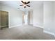 Bedroom featuring neutral walls, carpet flooring, a closet, and a doorway to another room at 6971 Tettenhall Ln, Windermere, FL 34786