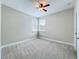 This bedroom has neutral walls, carpet flooring, white trim, and multiple bright windows at 6971 Tettenhall Ln, Windermere, FL 34786