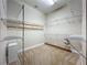 Spacious walk-in closet with carpeted floors and white wire shelving at 6971 Tettenhall Ln, Windermere, FL 34786