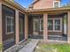 Screened-in lanai with rocky landscaping and a sidewalk at 6971 Tettenhall Ln, Windermere, FL 34786