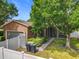 Home exterior with lush landscaping, screened-in lanai, and two-car garage at 6971 Tettenhall Ln, Windermere, FL 34786