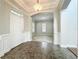 Bright and spacious foyer boasting neutral paint, tile flooring, and a clear view into the living room at 6971 Tettenhall Ln, Windermere, FL 34786
