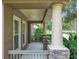 Inviting front porch showing the stone and stucco pillars, offering an outdoor relaxation space at 6971 Tettenhall Ln, Windermere, FL 34786