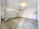 Spacious two-car garage with concrete floors and water heater at 6971 Tettenhall Ln, Windermere, FL 34786