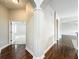 Welcoming hallway with hardwood floors, archways, and access to multiple rooms at 6971 Tettenhall Ln, Windermere, FL 34786