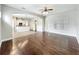 Large living room flows to the kitchen with hardwood floors at 6971 Tettenhall Ln, Windermere, FL 34786