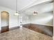 The living room connects to the kitchen with hardwood and tile floors plus ample natural light at 6971 Tettenhall Ln, Windermere, FL 34786