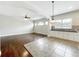 The open-concept living area boasts hardwood floors and abundant natural light, flowing into the kitchen at 6971 Tettenhall Ln, Windermere, FL 34786