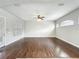 Open living room featuring hardwood floors and large windows at 6971 Tettenhall Ln, Windermere, FL 34786