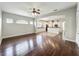 The open living room features hardwood floors and flows into the kitchen area at 6971 Tettenhall Ln, Windermere, FL 34786