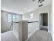 Upstairs loft area with carpet and railing overlooking the first floor at 6971 Tettenhall Ln, Windermere, FL 34786