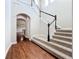 Elegant carpeted staircase with a dark wood banister at 6971 Tettenhall Ln, Windermere, FL 34786
