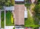 Overhead shot features well-maintained landscaping and lush green lawn surrounding the home at 7022 Talbot Dr, Orlando, FL 32819