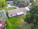 An aerial view of a quaint single-story home with a screened-in porch and spacious yard at 7022 Talbot Dr, Orlando, FL 32819