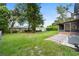 Spacious backyard with lush green grass and perimeter trees, perfect for outdoor activities at 7022 Talbot Dr, Orlando, FL 32819