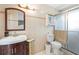 Bathroom showcases a well-lit vanity, tiled walls, and a glass-enclosed shower for a modern touch at 7022 Talbot Dr, Orlando, FL 32819