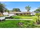 Charming single-story home with lush green lawn and well-manicured landscaping at 7022 Talbot Dr, Orlando, FL 32819