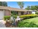 Attractive home exterior featuring well-maintained shrubs, green lawn, and charming front yard decor at 7022 Talbot Dr, Orlando, FL 32819