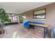 Screened lanai with view of the home, with a table for lounging at 7022 Talbot Dr, Orlando, FL 32819