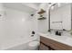 Modern bathroom with dark fixtures, updated vanity, and a shower/tub combo at 745 Ashley Ln, Orlando, FL 32825