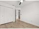 Bright room featuring a ceiling fan, light hardwood floors and a spacious closet at 745 Ashley Ln, Orlando, FL 32825