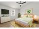Bright bedroom featuring a ceiling fan, modern art, and a window with natural light at 745 Ashley Ln, Orlando, FL 32825