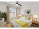 Bright bedroom featuring a ceiling fan, modern art, and a window with natural light at 745 Ashley Ln, Orlando, FL 32825
