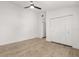 Bright room featuring a ceiling fan, light hardwood floors and a spacious closet at 745 Ashley Ln, Orlando, FL 32825