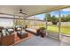 Inviting screened porch with comfortable seating, perfect for outdoor relaxation and entertaining at 745 Ashley Ln, Orlando, FL 32825