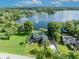 Aerial view of the home, showcasing its prime location on a picturesque lake at 7801 Georgeann St, Winter Park, FL 32792