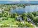 A bright aerial view of the home showcasing its backyard on a waterfront at 7801 Georgeann St, Winter Park, FL 32792