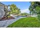 Scenic backyard with a pool, gazebo, lush landscaping, and panoramic views of the tranquil lake at 7801 Georgeann St, Winter Park, FL 32792