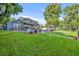 Stunning backyard featuring a modern home, a sparkling pool, and a charming gazebo at 7801 Georgeann St, Winter Park, FL 32792