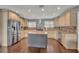 Modern kitchen with center island, stainless steel appliances, and custom cabinets at 7801 Georgeann St, Winter Park, FL 32792