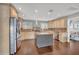 Well-equipped kitchen with a large island, stainless steel appliances, and ample storage at 7801 Georgeann St, Winter Park, FL 32792