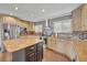 Elegant kitchen featuring granite countertops, center island, and lots of cabinets at 7801 Georgeann St, Winter Park, FL 32792