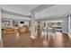 Open concept living and dining room with lake views through sliding glass doors at 7801 Georgeann St, Winter Park, FL 32792