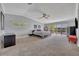 Large main bedroom with ceiling fan, view of the water, and private access to the balcony at 7801 Georgeann St, Winter Park, FL 32792