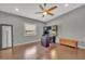 Bright home office with natural light, offering a dedicated workspace with built-in shelving and storage at 7801 Georgeann St, Winter Park, FL 32792